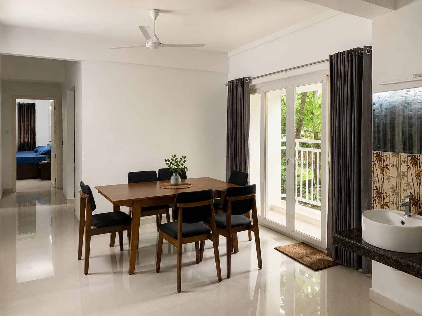 Village Nest — dining area opening to the balcony